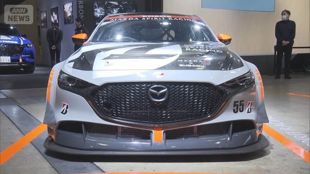 <ruby><rb><span class="jlpt-n5" word="二">二</span><span class="jlpt-n1" word="酸化">酸化</span><span class="jlpt-n1" word="炭素">炭素</span></rb><rt>にさんかたんそ</rt></ruby><span class="" word="を">を</span><ruby><rb><span class="" word="集">集</span></rb><rt>あつ</rt></ruby><span class="" word="め">め</span><span class="" word="る">る</span><span class="jlpt-n1" word="スポーツカー">スポーツカー</span><span class="" word="が">が</span><ruby><rb><span class="unknown" word="東京">東京</span></rb><rt>とうきょう</rt></ruby><span class="" word="オ">オ</span><span class="" word="ー">ー</span><span class="" word="ト">ト</span><span class="" word="サ">サ</span><span class="" word="ロ">ロ</span><span class="" word="ン">ン</span><span class="" word="で">で</span><ruby><rb><span class="" word="見">見</span></rb><rt>み</rt></ruby><span class="" word="ら">ら</span><span class="" word="れ">れ</span><span class="" word="ま">ま</span><span class="" word="す">す</span>