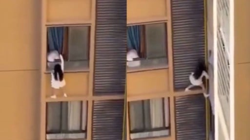 中国で女性がマンション10階の窓から逃げる